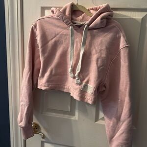 Gently used Champion women sized XS pink cropped hooded sweatshirt